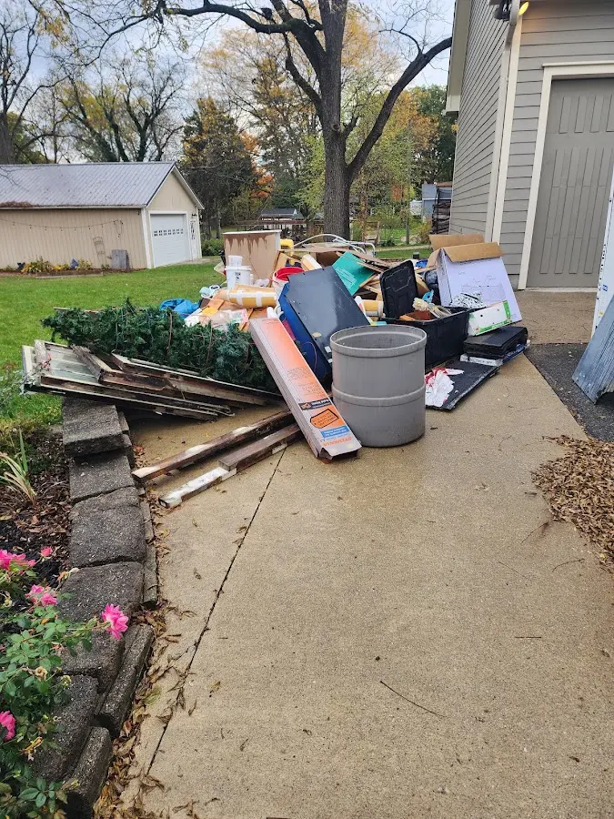 Dumpster being loaded with debris for 30 Yard Dumpster Rental in Wheeling